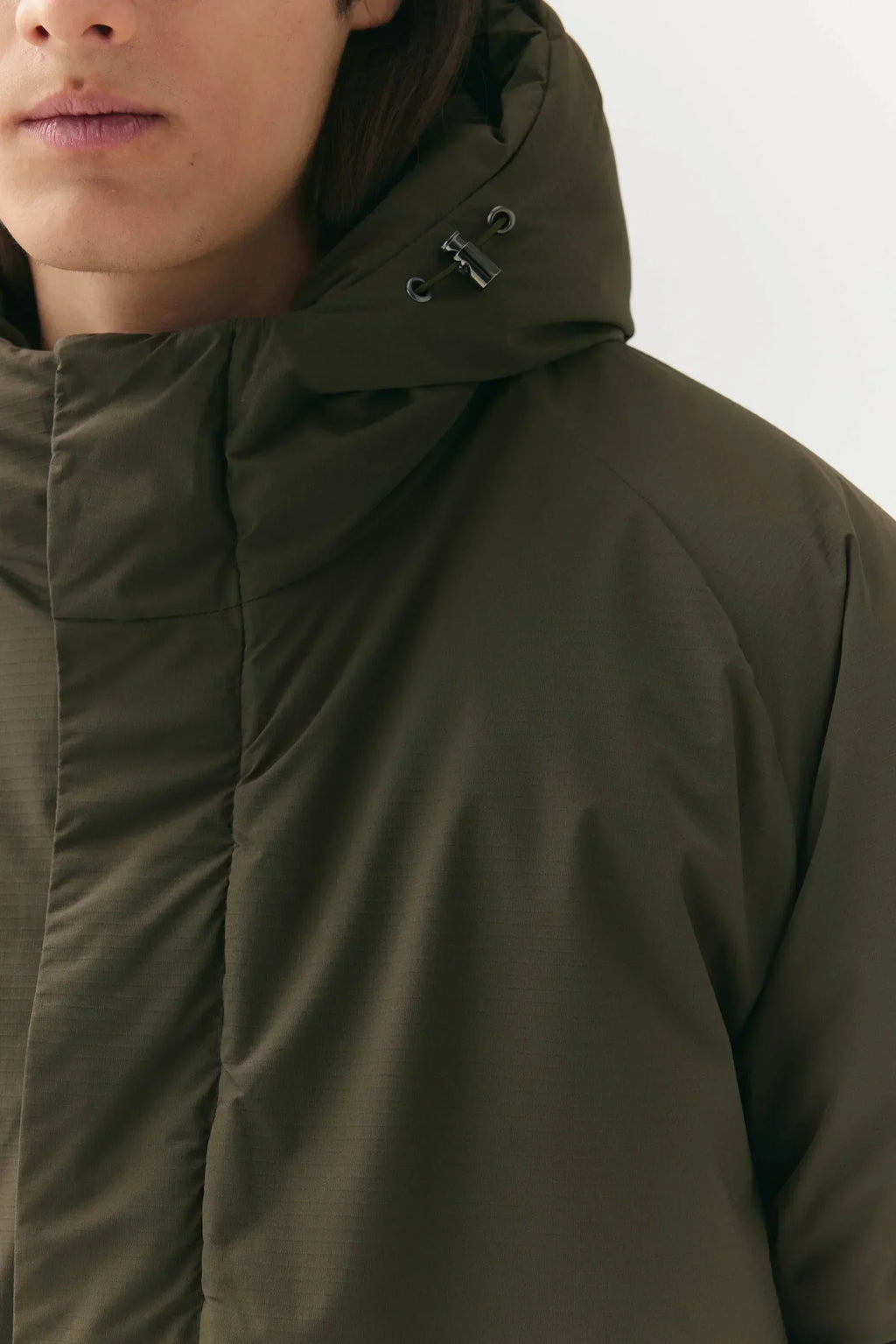 Prestige Market K-SEA New Army Jacket displayed on a hanger, featuring a stylish military-inspired design and durable fabric.