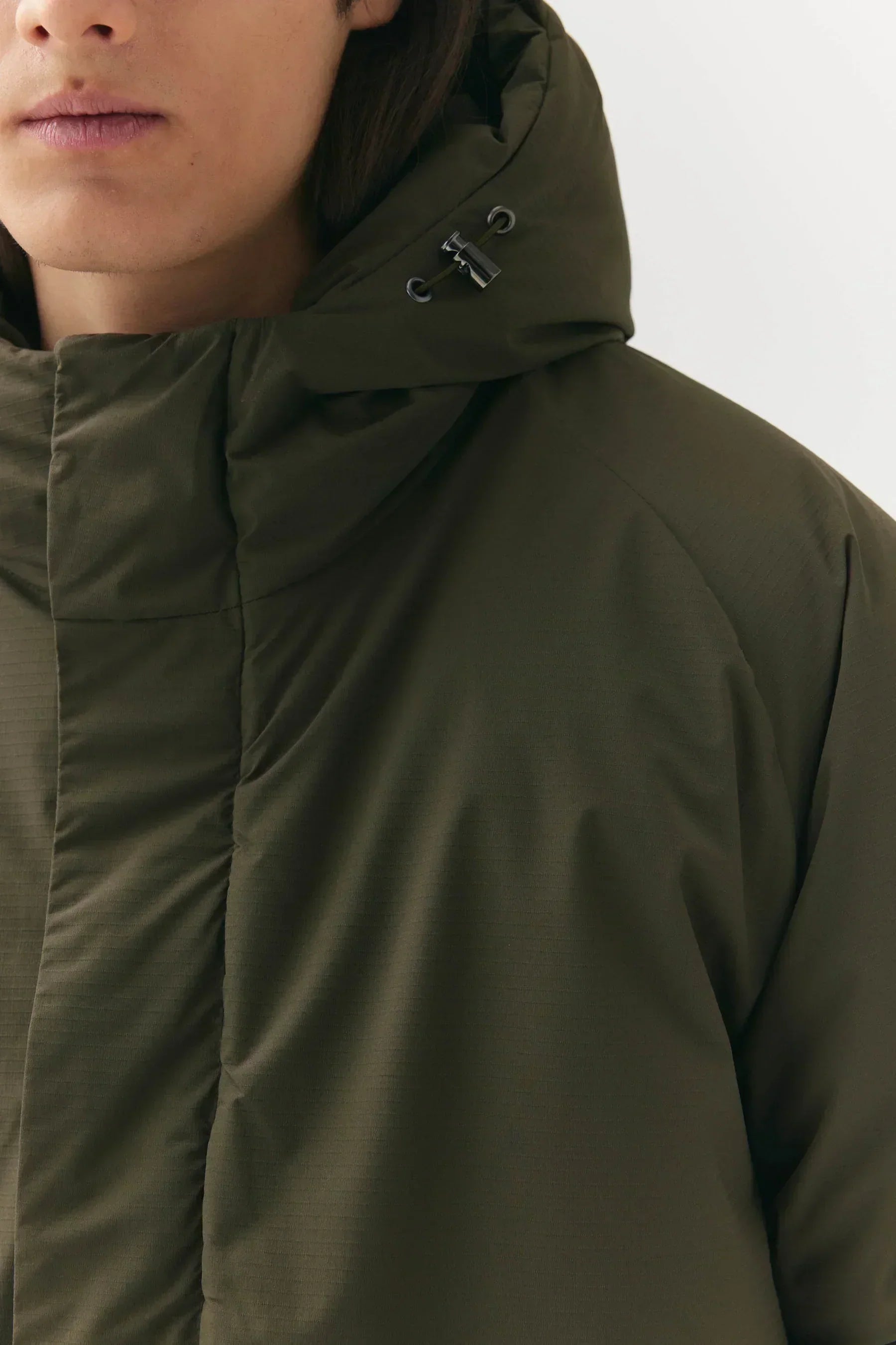 Prestige Market K-SEA New Army Jacket displayed on a hanger, featuring a stylish military-inspired design and durable fabric.