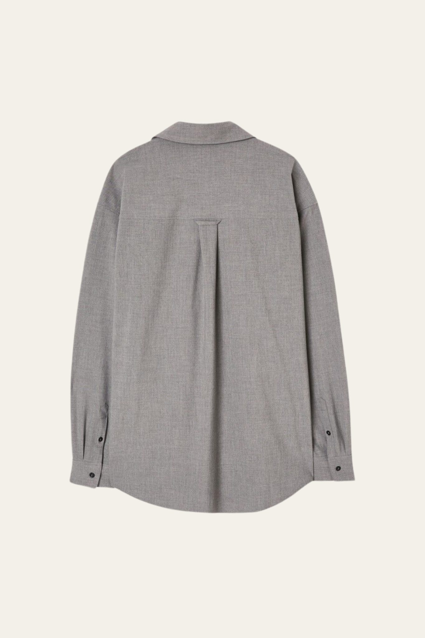 Grey KABIRD shirt by Prestige Market displayed on a hanger, showing the shirt's fabric and collar details.